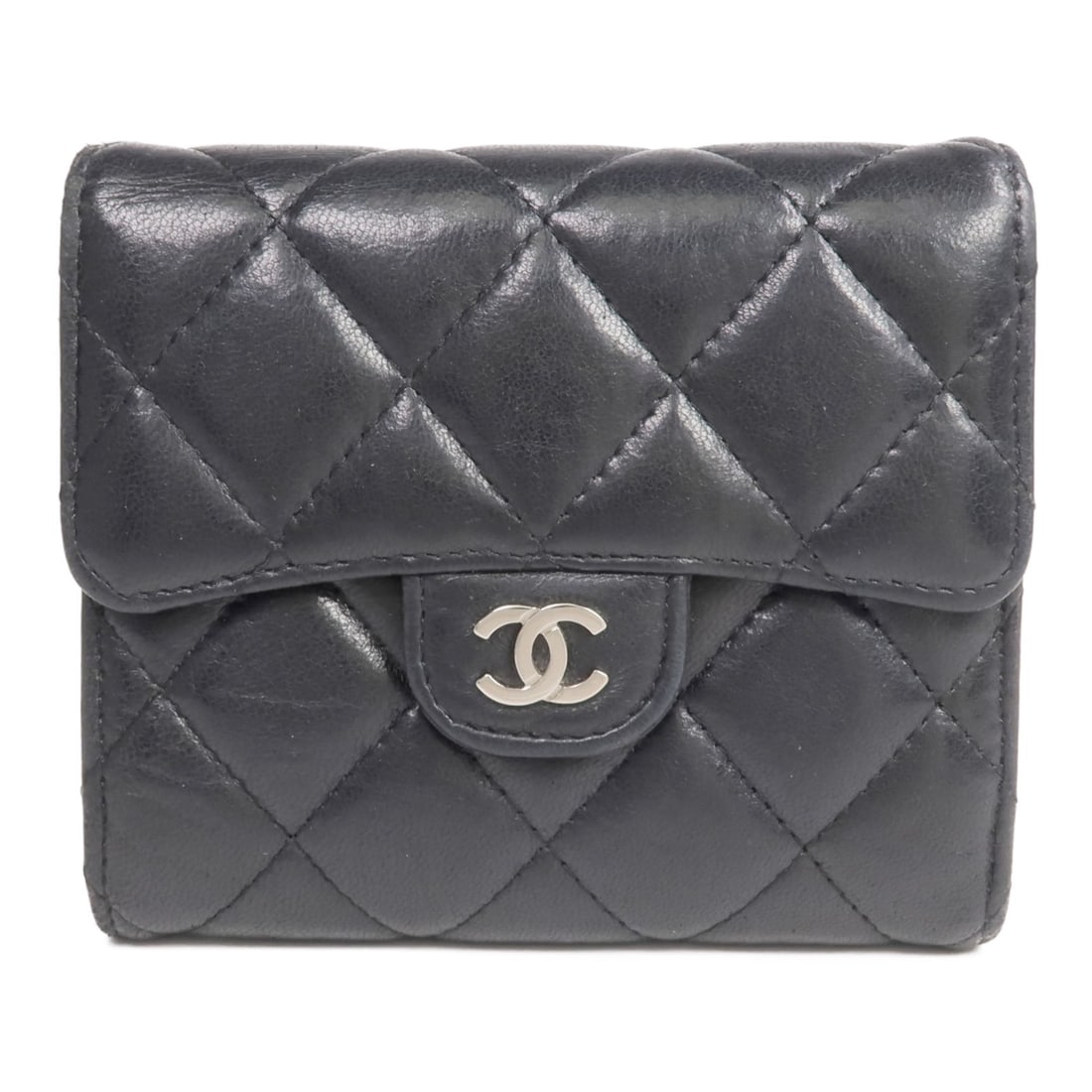 Black Lambskin Tri-Fold Wallet by Chanel with Silver Tone CC: Black Lambskin Tri-Fold Wallet by Chanel with Silver Tone CC This CHANEL tri-fold wallet is crafted from luxurious black lambskin leather and features the iconic CC logo with silver-tone hardware. Des
