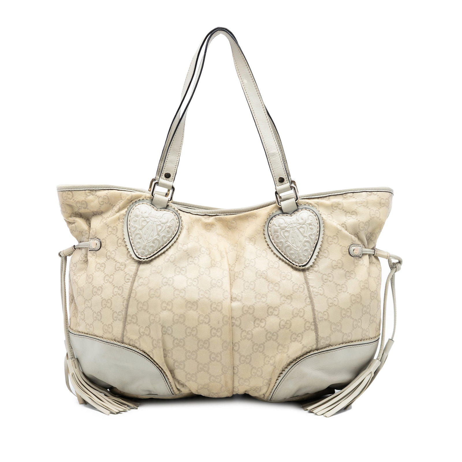 Gucci Tribeca Beige Leather Tote with Embossed Guccissima Pattern: Gucci Tribeca Beige Leather Tote with Embossed Guccissima Pattern The Gucci Large Guccissima Tribeca Tote is crafted from embossed leather and features tassel details, flat leather straps, and an open