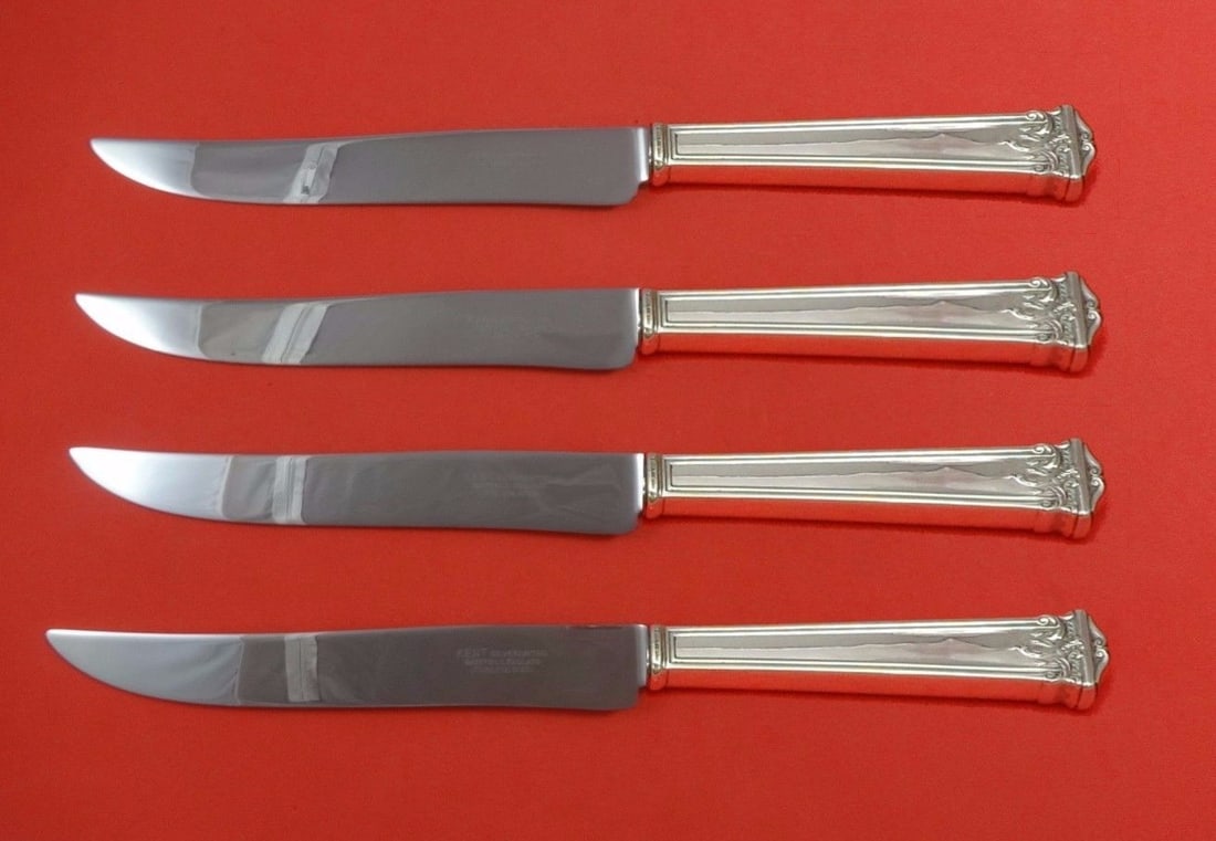 Texas Sized 4pc Trianon Sterling Silver Steak Knife Set by International: Texas Sized 4pc Trianon Sterling Silver Steak Knife Set by International Elevate your dining experience with this 4-piece steak knife set from the Trianon pattern by International Sterling. Crafted fr