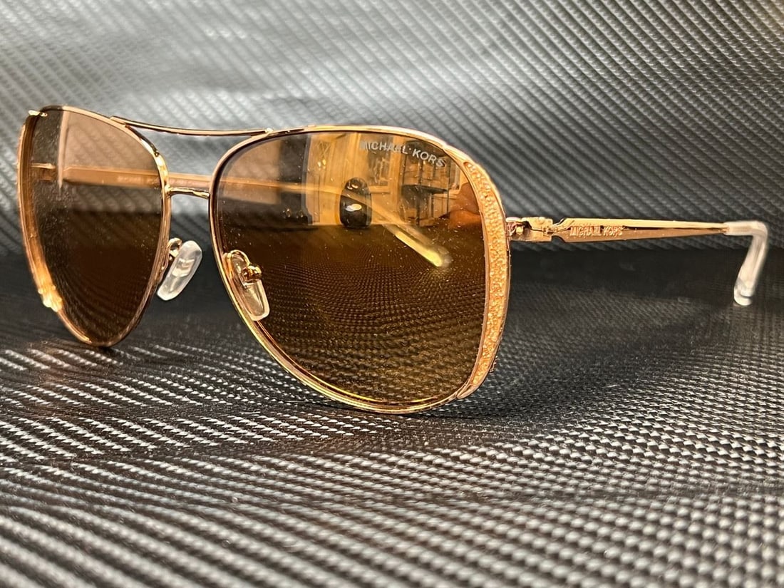 Michael Kors MK1082 1108R1 Rose Gold Women's Sunglasses with Case: Michael Kors MK1082 1108R1 Rose Gold Women's Sunglasses with Case Elevate your eyewear collection with these stylish Michael Kors MK1082 1108R1 sunglasses, designed for women. These sunglasses feature