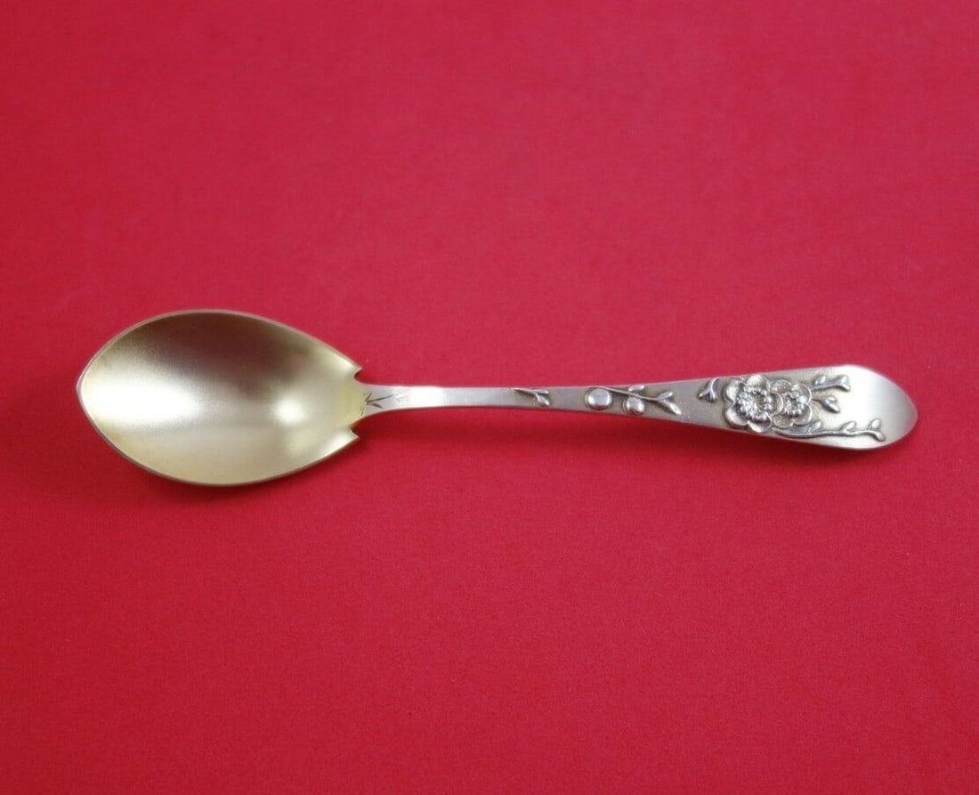 Tiffany & Co Sterling Silver 6 Inch Ice Cream Spoon Lap Over Edge with Floral Design: Tiffany & Co Sterling Silver 6 Inch Ice Cream Spoon Lap Over Edge with Floral Design This exquisite ice cream spoon from Tiffany & Co., crafted between 1850 and 1899, showcases the elegant Lap Over Ed