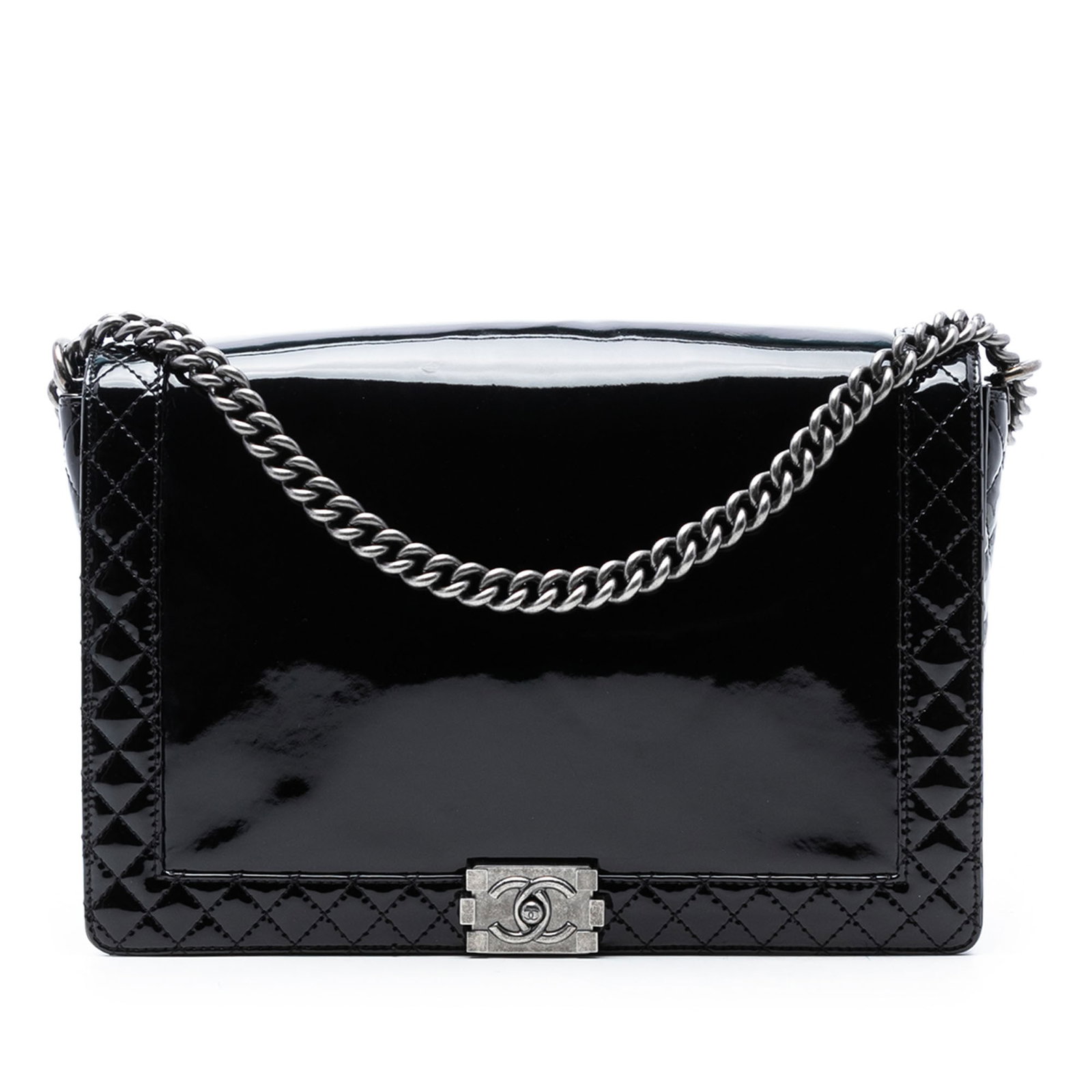 Black Patent Leather Boy Reverso Extra Large Flap Bag by Chanel: Black Patent Leather Boy Reverso Extra Large Flap Bag by Chanel The Chanel Extra Large Patent Boy Reverso Flap is crafted from black patent leather and features a silver-tone curb chain link with an a