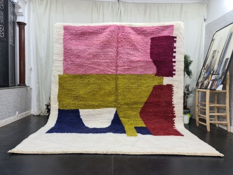 Handmade Colorful Wool Rug 9.84 x 6.56 Feet from Morocco: Handmade Colorful Wool Rug 9.84 x 6.56 Feet from Morocco Experience the beauty of craftsmanship with this stunning, handmade colorful wool rug. This soft rug was meticulously handwoven in the Middle A