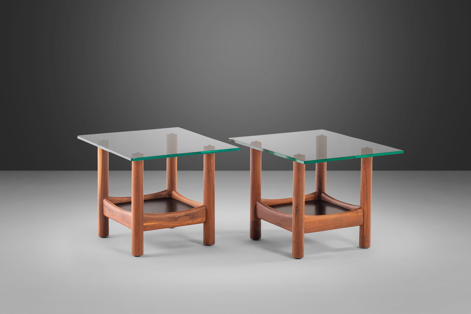 1960s Adrian Pearsall Style Walnut Glass-Top End Tables Set of 2: 1960s Adrian Pearsall Style Walnut Glass-Top End Tables Set of 2 Enhance your living space with this stunning set of two tubular glass-top end tables, inspired by the iconic designs of Adrian Pearsall