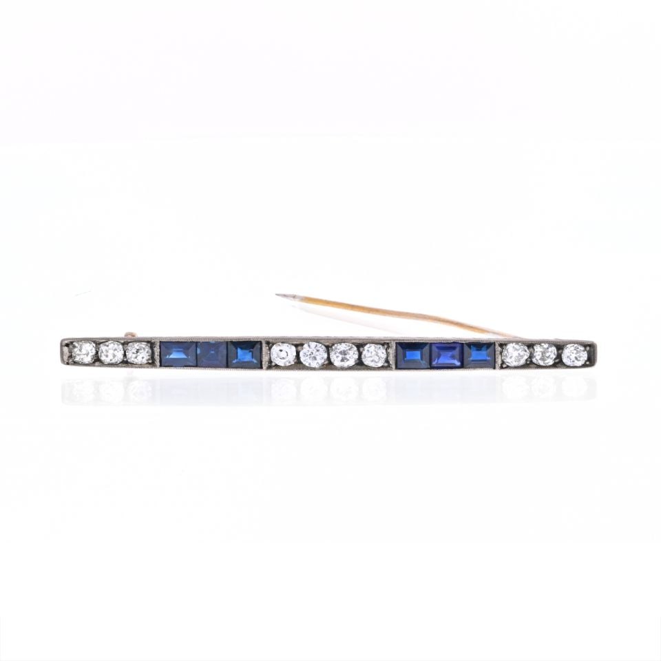 Vintage Platinum 18K Gold Sapphire Diamond Bar Brooch 2 Cts: Vintage Platinum 18K Gold Sapphire Diamond Bar Brooch 2 Cts This exquisite brooch features a captivating design crafted from a combination of platinum and 18K yellow gold. It showcases a stunning arra