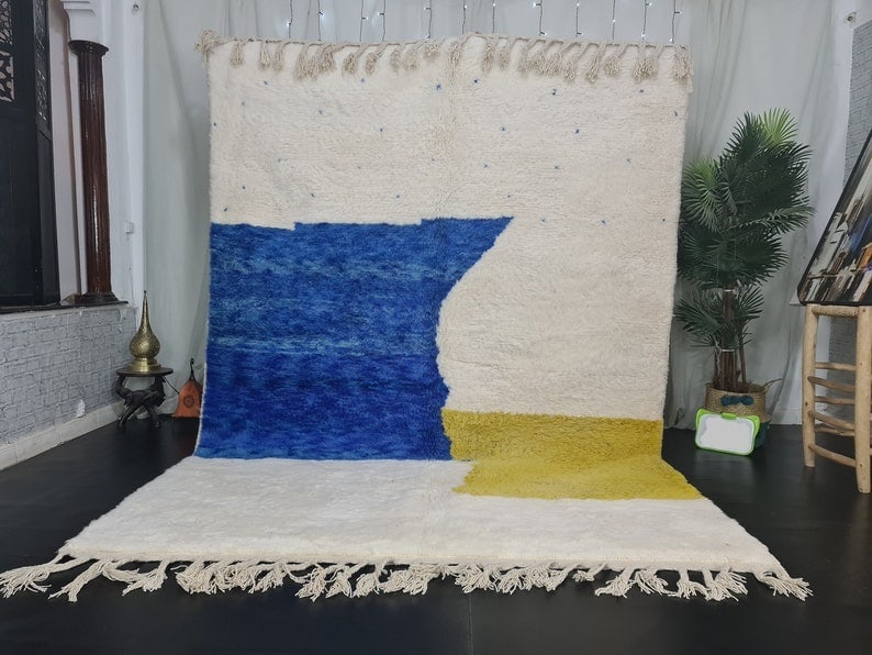 Handmade Moroccan Berber Wool Rug Soft White Blue Yellow: Handmade Moroccan Berber Wool Rug Soft White Blue Yellow Transform your living space with this Fabulous Soft Handmade Moroccan Berber Wool Rug, featuring a stunning blend of white, blue, and yellow wi
