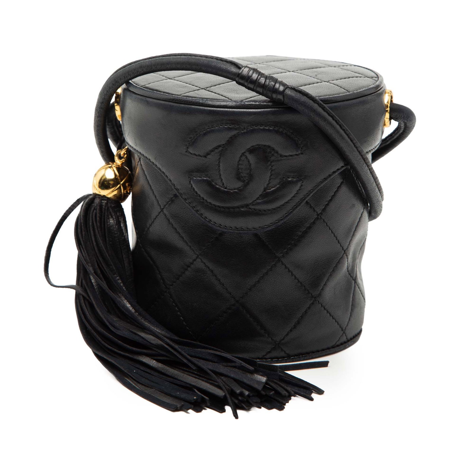 Chanel Mini Canteen Vanity Bag in Quilted Lambskin Leather with Tassel: Chanel Mini Canteen Vanity Bag in Quilted Lambskin Leather with Tassel This Chanel Mini Quilted Lambskin Canteen Tassel Vanity Case features a quilted lambskin leather exterior in black, a rolled leat