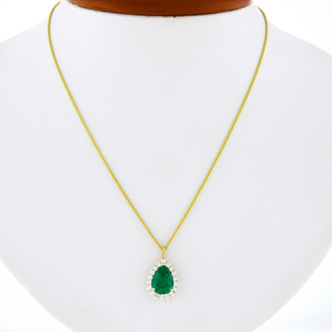 14k Gold SSEF Certified Teardrop Emerald & Diamond Halo Pendant Necklace: 14k Gold SSEF Certified Teardrop Emerald & Diamond Halo Pendant Necklace This exquisite pendant necklace features a stunning 14k solid yellow gold construction, showcasing a vibrant natural emerald in