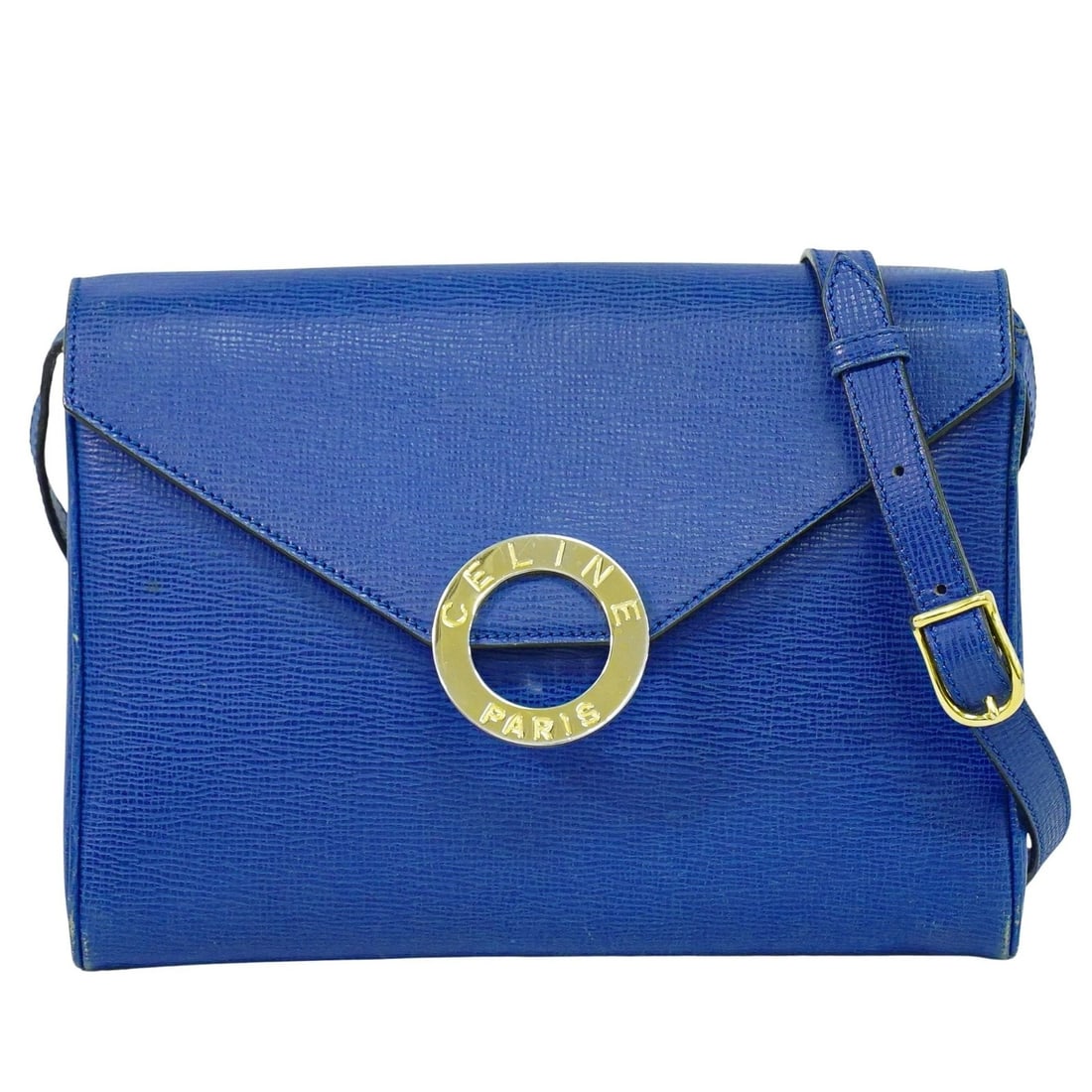 Celine Leather Shoulder Bag Blue Circle Logo 24cm by 17cm: Celine Leather Shoulder Bag Blue Circle Logo 24cm by 17cm This Celine Circle Logo Shoulder Bag for women features a blue leather exterior with a sleek design. It shows signs of use including corner sc