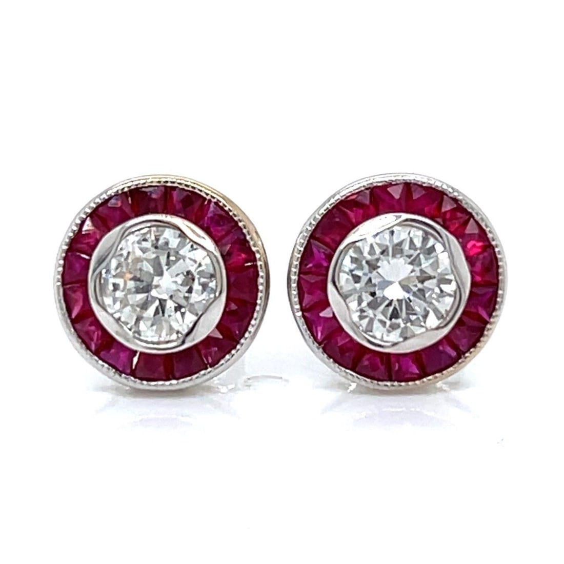Ruby and Diamond Stud Earrings in 18K White Gold 2.5g: Ruby and Diamond Stud Earrings in 18K White Gold 2.5g These elegant stud earrings are crafted from 18K white gold and feature two diamonds with a total weight of 0.96 carats, graded H-I in color and S