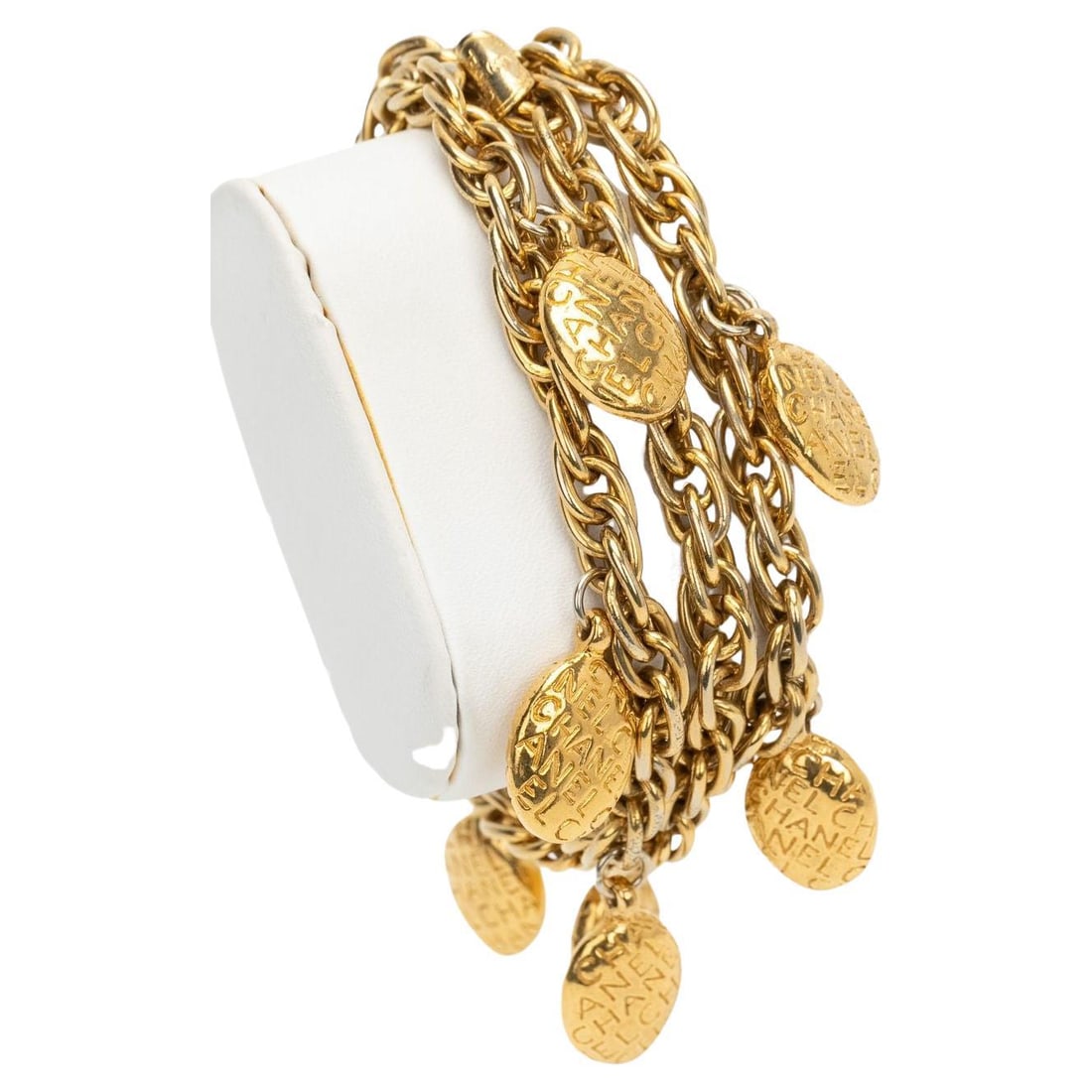 Chanel 70s Vintage Gold Chain Bracelet Made in Italy: Chanel 70s Vintage Gold Chain Bracelet Made in Italy This stunning vintage bracelet from Chanel showcases a unique 70s design, featuring a beautiful chain adorned with charming accents. Crafted from b