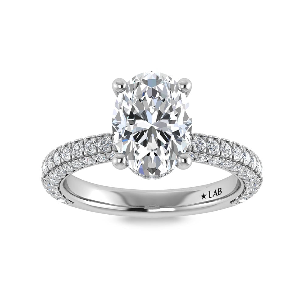 14K White Gold Lab Grown Diamond 4 Ct.Tw. Oval Shape Halo Engagement Ring (IGI Certified Center: 14K White Gold Lab Grown Diamond 4 Ct.Tw. Oval Shape Halo Engagement Ring (IGI Certified Center 3ct) Discover subtle brilliance and modern elegance with our Hidden Halo Diamond Engagement Ring. This e