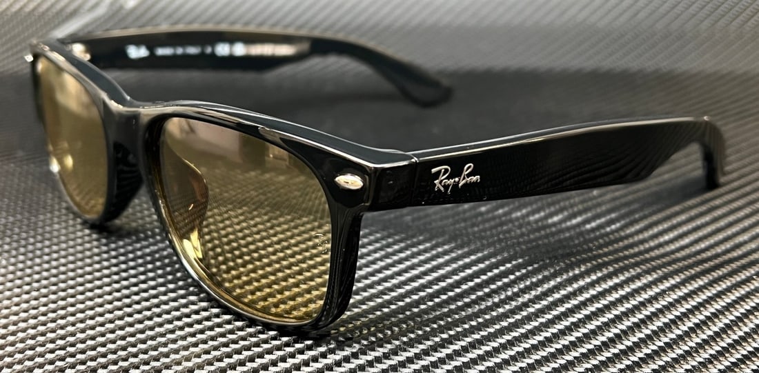 Ray-Ban RB2132F 601 R6 Black Frame Yellow Lens Sunglasses: Ray-Ban RB2132F 601 R6 Black Frame Yellow Lens Sunglasses Introducing the Ray-Ban RB2132F 601 R6 Sunglasses, a stylish accessory perfect for any occasion. Featuring a sleek black frame paired with vib