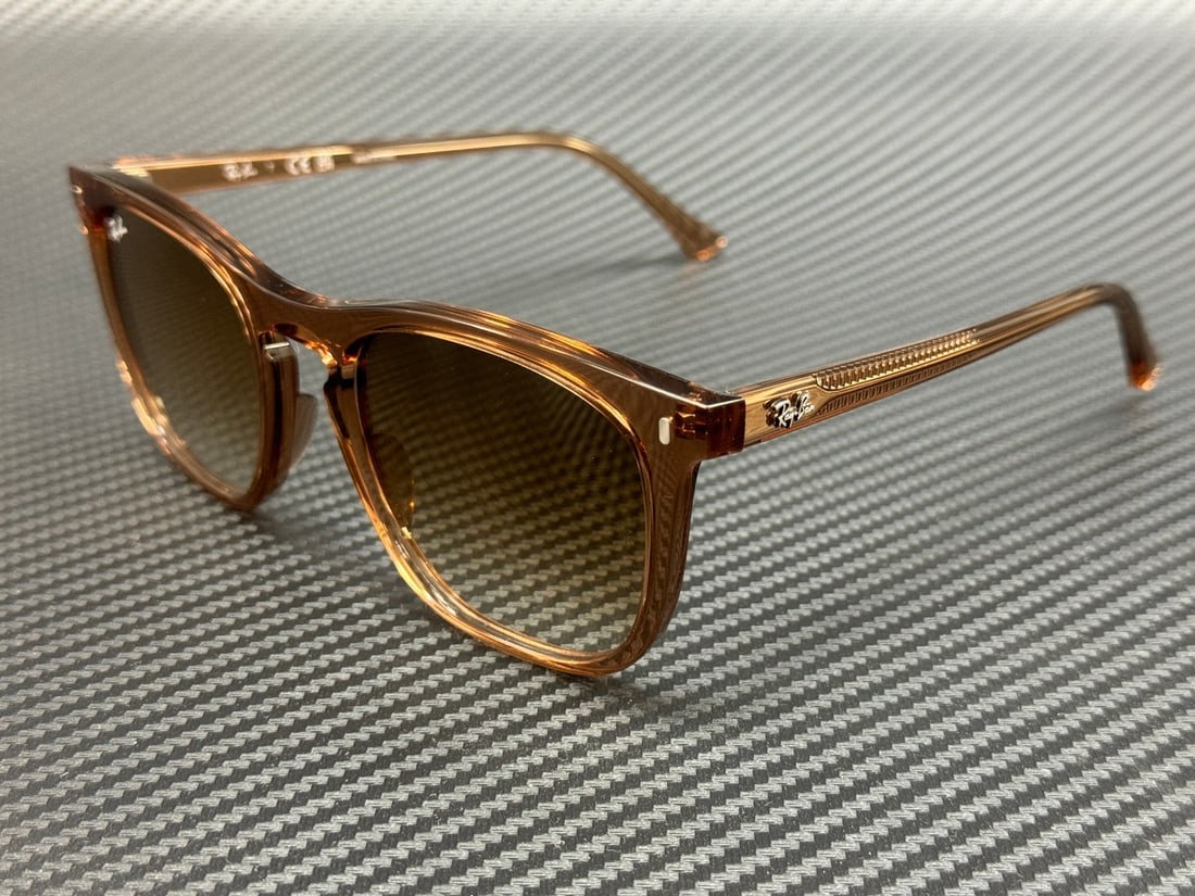 Ray-Ban RB2210 676451 Transparent Brown Unisex Sunglasses with Certificate: Ray-Ban RB2210 676451 Transparent Brown Unisex Sunglasses with Certificate Elevate your style with these RAY-BAN RB2210 676451 sunglasses, featuring a transparent brown frame and gradient brown lenses