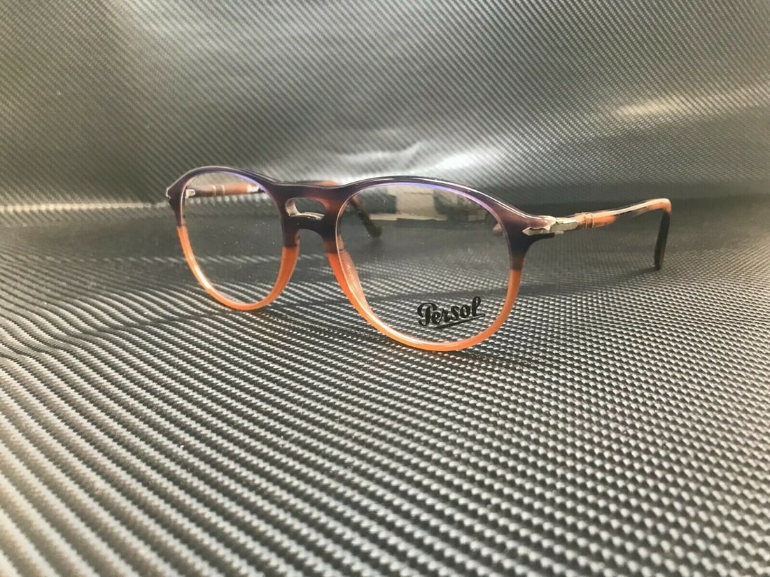 Persol PO3202V 1066 Blue Striped Orange Eyeglasses with Demo Lens: Persol PO3202V 1066 Blue Striped Orange Eyeglasses with Demo Lens Discover the stylish and sophisticated PERSOL PO3202V 1066 unisex eyeglasses, featuring a striking blue striped orange frame. These ey