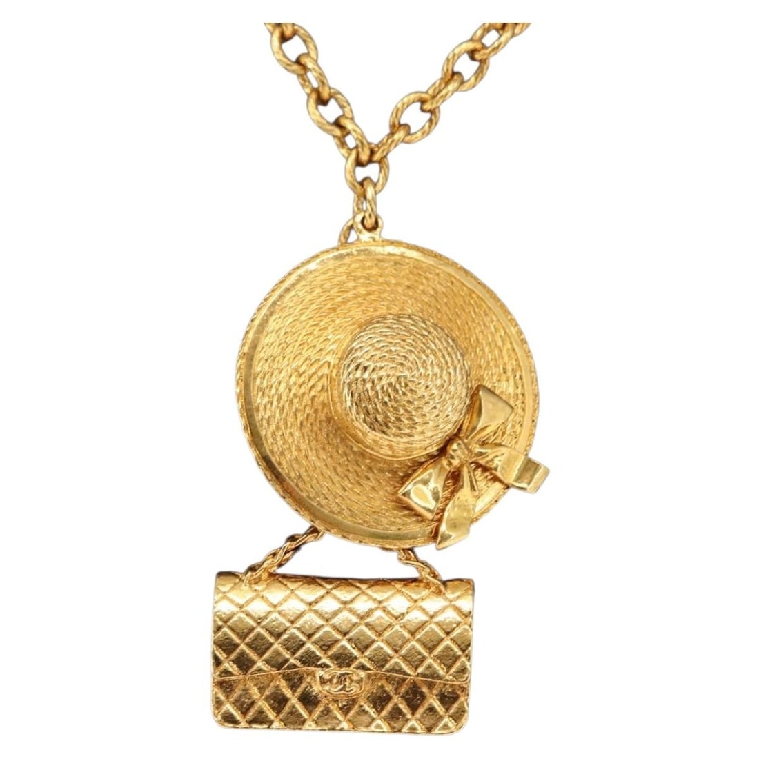 Gold Metal CC Pendant Necklace by CHANEL with Box: Gold Metal CC Pendant Necklace by CHANEL with Box This CHANEL necklace features a gold-tone metal construction and showcases the iconic CC design. Crafted in France, the necklace measures approximatel