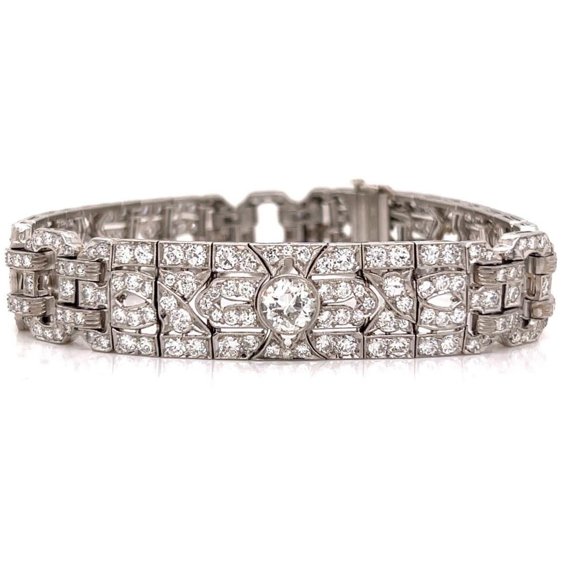 Platinum Art Deco Bracelet with 13.50 Carats Diamonds 7 Inch: Platinum Art Deco Bracelet with 13.50 Carats Diamonds 7 Inch This Art Deco platinum bracelet features a total diamond weight of approximately 13.50 carats. The design is set with three European-cut di