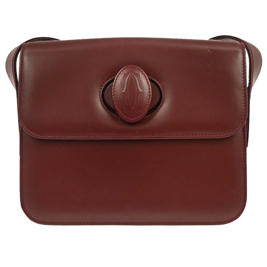 Burgundy Leather Shoulder Bag by Cartier Must de Cartier: Burgundy Leather Shoulder Bag by Cartier Must de Cartier This burgundy Must de Cartier shoulder bag is crafted from leather and designed for women. It features a compact size suitable for daily use wi