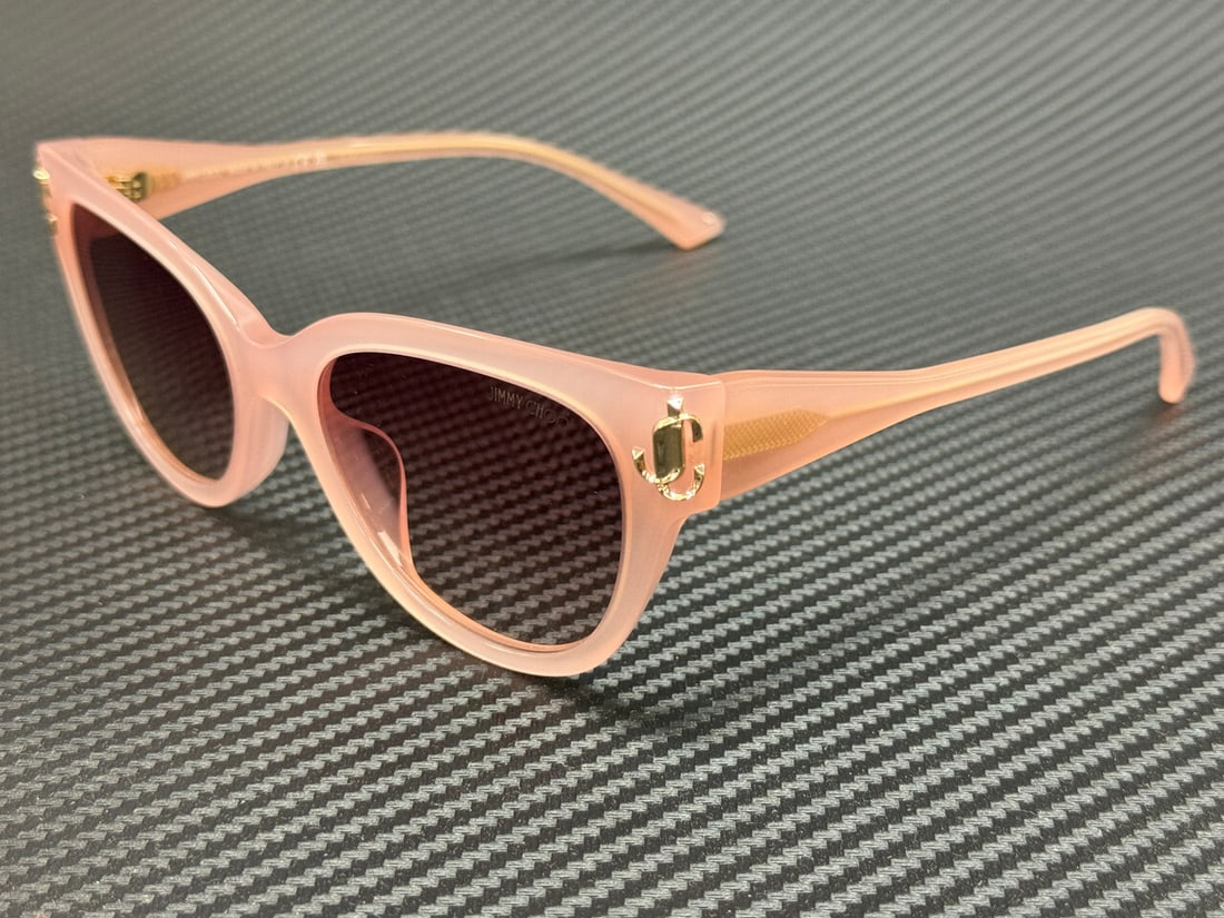 Jimmy Choo JC5018U 502768 Pink Gradient Sunglasses with Authenticity Certificate: Jimmy Choo JC5018U 502768 Pink Gradient Sunglasses with Authenticity Certificate Elevate your style with these exquisite Jimmy Choo JC5018U 502768 sunglasses. Featuring a chic pink frame, these sungla