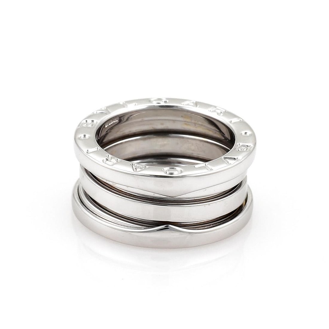 Bvlgari B Zero-1 18k White Gold 9mm Ring Size 47 US 4: Bvlgari B Zero-1 18k White Gold 9mm Ring Size 47 US 4 This exquisite Bulgari B Zero-1 ring band is expertly crafted from 18k white gold, showcasing a stylish flex design. The ring features a comfortab