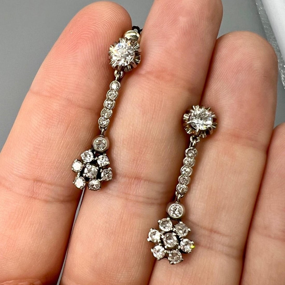 Pair of Art Deco Platinum Earrings with 2.40 Carat Diamonds: Pair of Art Deco Platinum Earrings with 2.40 Carat Diamonds Art Deco platinum earrings featuring a total of approximately 2.40 carats of diamonds. The earrings are set with 28 diamonds of G-H color an