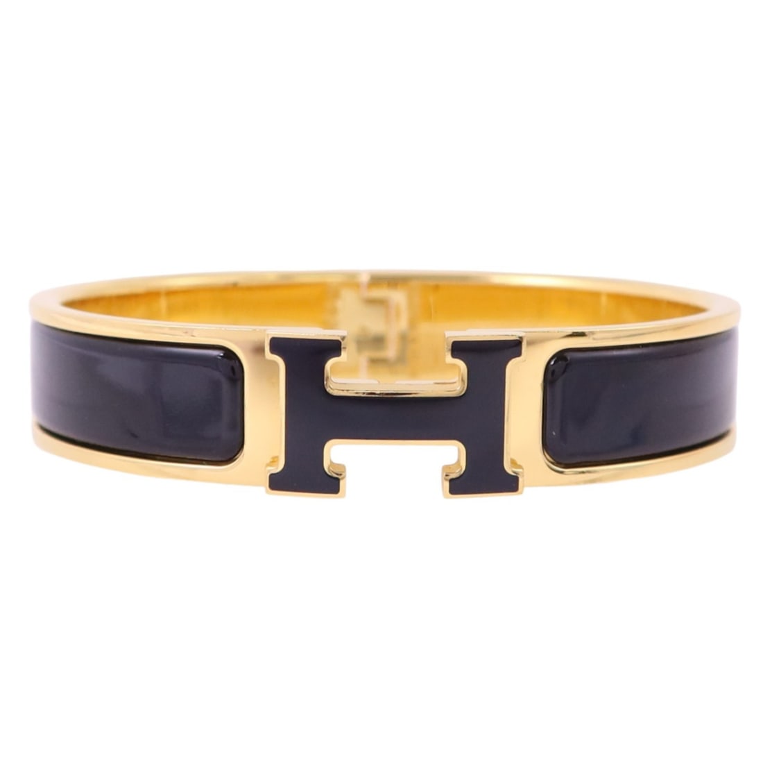 Hermes Black Enamel Clic H Bracelet with Gold Tone Hardware: Hermes Black Enamel Clic H Bracelet with Gold Tone Hardware This Hermes Clic H bracelet features a black enamel finish with gold tone metal accents. Designed for women, it offers a sophisticated and s