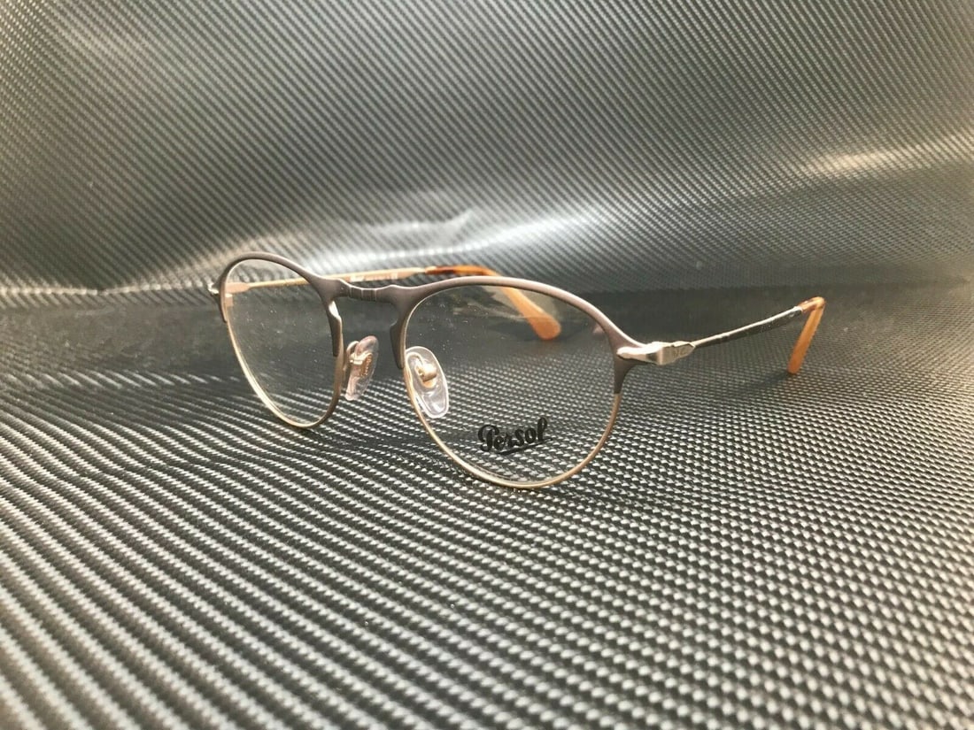 Persol PO7092V 1071 Matte Grey Square Eyeglasses with Authenticity Certificate: Persol PO7092V 1071 Matte Grey Square Eyeglasses with Authenticity Certificate Introducing the Persol PO7092V 1071, a stylish pair of square eyeglasses designed for men. Featuring a sophisticated matt