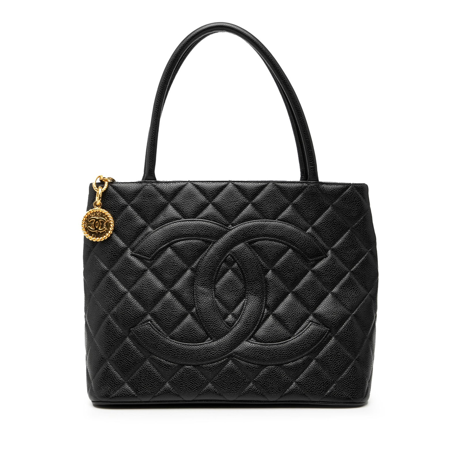 Black Quilted Leather Chanel Medallion Tote Handbag with Rolled Handles: Black Quilted Leather Chanel Medallion Tote Handbag with Rolled Handles This Chanel Caviar Medallion Tote features a quilted caviar leather exterior in black, rolled leather handles, a top zip closure