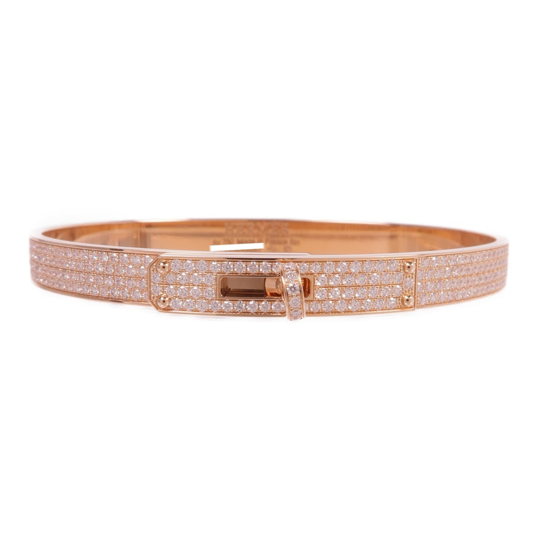 Diamond Small Kelly Bracelet in 18K Rose Gold by Hermes: Diamond Small Kelly Bracelet in 18K Rose Gold by Hermes This Hermes Kelly small model bracelet features 18K pink gold adorned with diamond accents. Crafted in France, it showcases a pristine condition