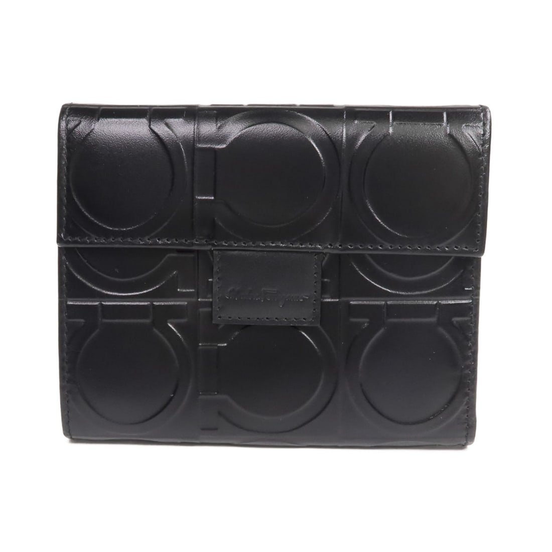 Ferragamo Black Calfskin Bi-Fold Wallet with Silver Hardware: Ferragamo Black Calfskin Bi-Fold Wallet with Silver Hardware This Salvatore Ferragamo bi-fold wallet is crafted from black calfskin leather, offering a sleek and refined accessory for men. Made in Ita