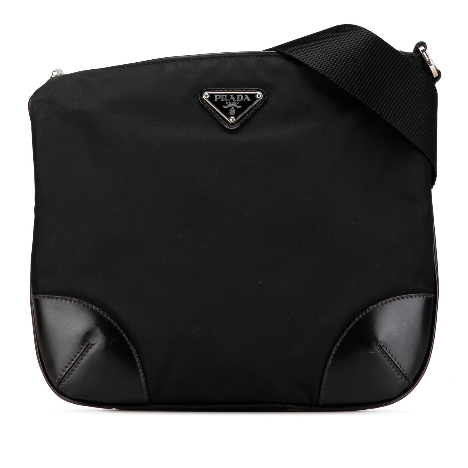Prada Tessuto Nylon Crossbody Bag with Leather Accents Zip Top: Prada Tessuto Nylon Crossbody Bag with Leather Accents Zip Top This Prada Vitello Trimmed Tessuto Zip Top Crossbody bag features a nylon body with leather trim, an adjustable flat shoulder strap, a to