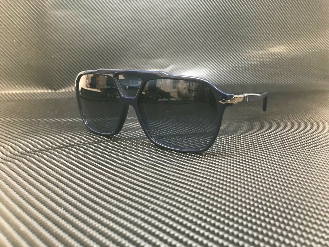 PERSOL PO3223S 1109Q8 Blue Gradient Square Sunglasses: PERSOL PO3223S 1109Q8 Blue Gradient Square Sunglasses Discover the stylish PERSOL PO3223S Sunglasses, designed for the modern man. These square sunglasses feature a striking blue frame that complement