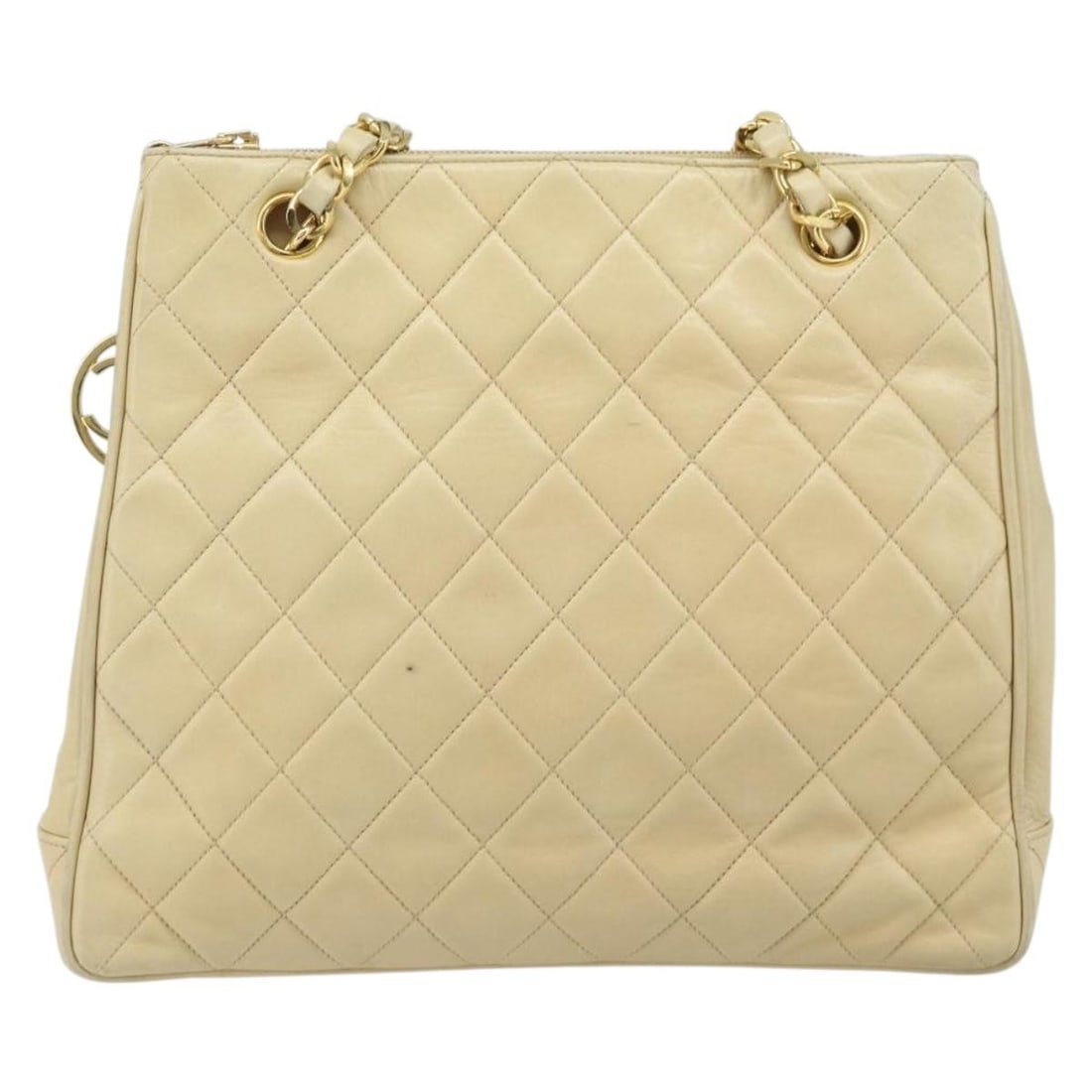 Chanel Beige Quilted Lambskin Vintage Chain Shoulder Tote Bag: Chanel Beige Quilted Lambskin Vintage Chain Shoulder Tote Bag This Chanel Vintage Chain Tote is crafted from quilted lambskin leather in a beige color. Designed for women, it features a classic chain