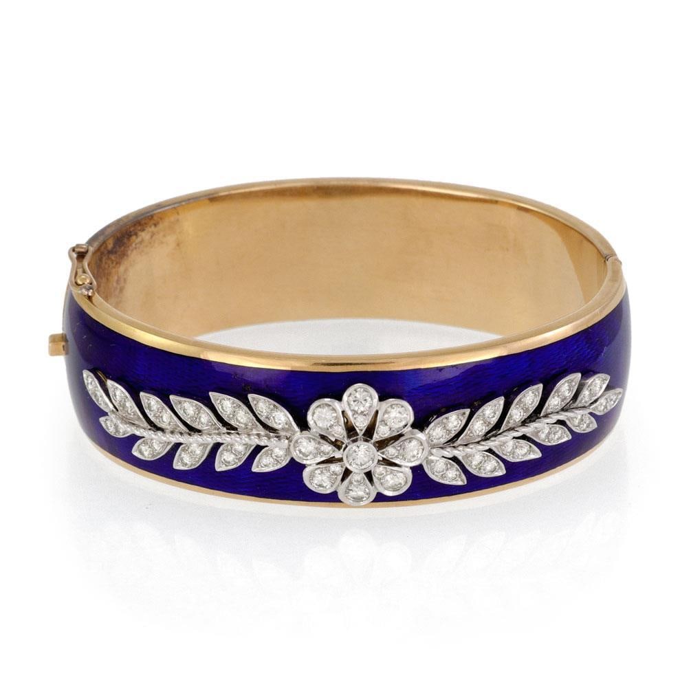 Vintage 2ct Diamond Floral 18k Gold Blue Enamel Hinged Bangle Bracelet: Vintage 2ct Diamond Floral 18k Gold Blue Enamel Hinged Bangle Bracelet This exquisite vintage bangle bracelet showcases a stunning design crafted from 18k yellow and white gold. The bracelet features