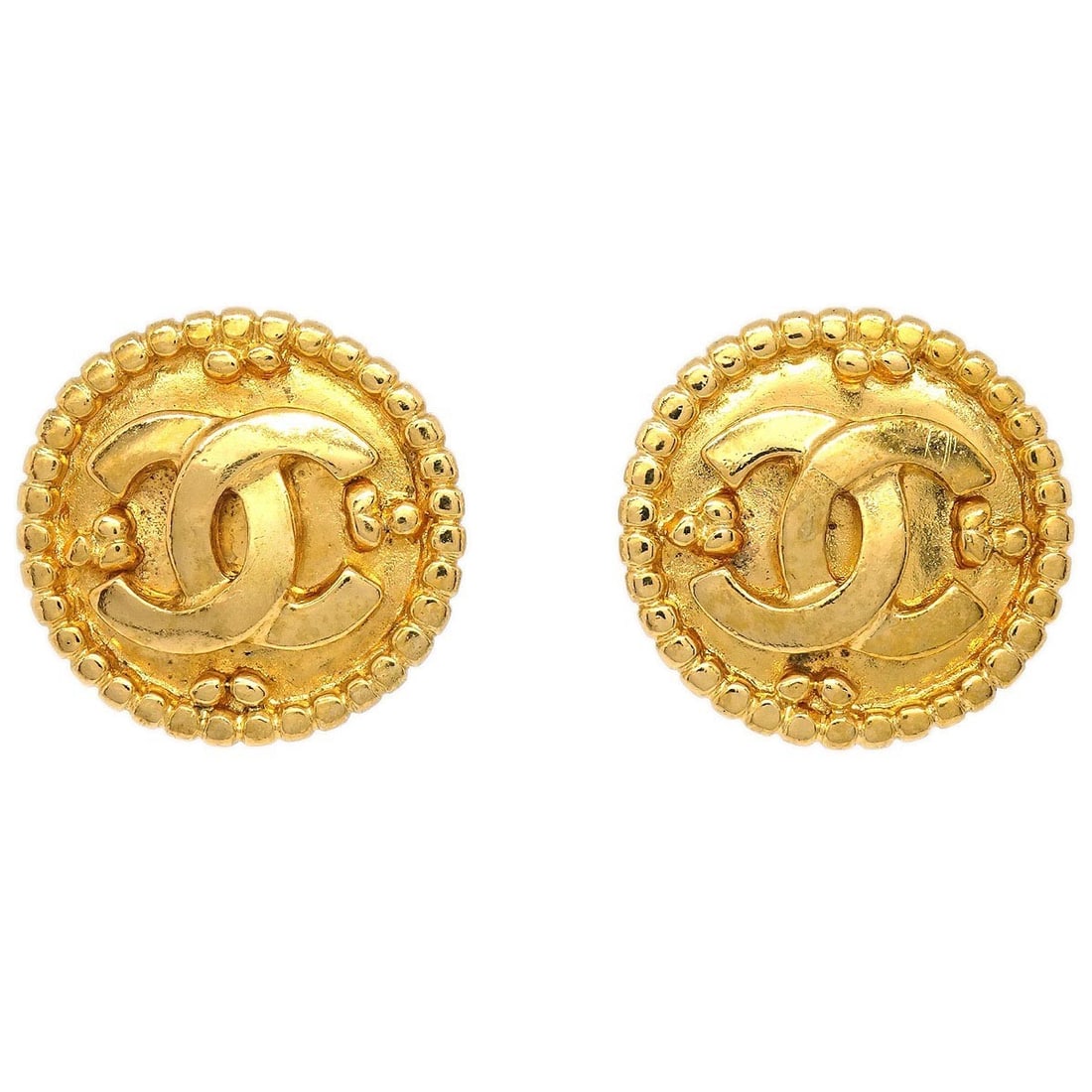 Chanel 96A Gold Tone Logo Button Clip-On Earrings: Chanel 96A Gold Tone Logo Button Clip-On Earrings These Chanel button-shaped clip-on earrings feature a gold-tone finish and showcase the iconic logo design. Crafted in France, they offer a classic an