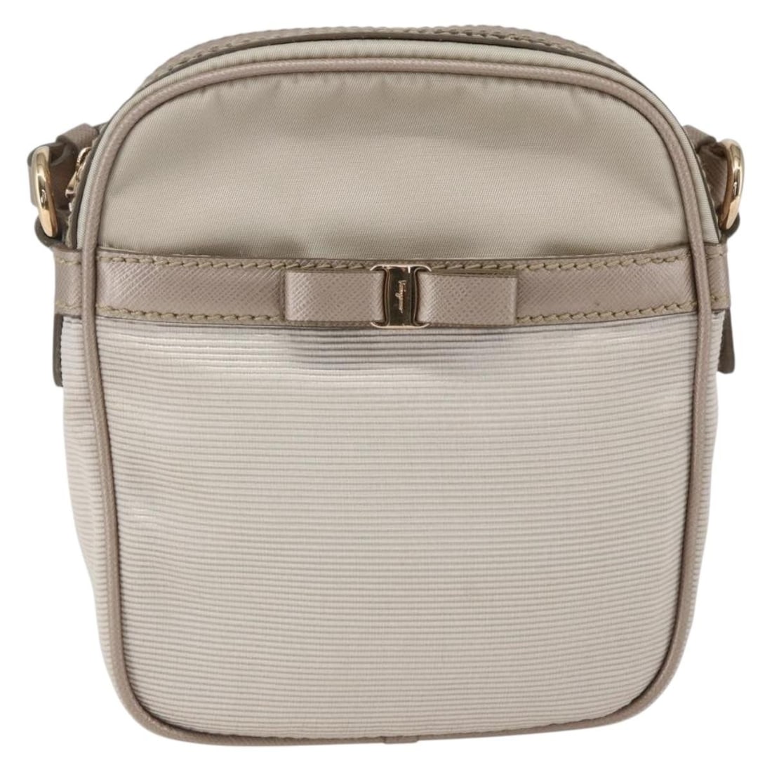 Beige Nylon Vala Shoulder Bag by Salvatore Ferragamo: Beige Nylon Vala Shoulder Bag by Salvatore Ferragamo This pre-owned Salvatore Ferragamo Vala shoulder bag for women features a beige nylon exterior and compact dimensions, suitable for everyday use. I