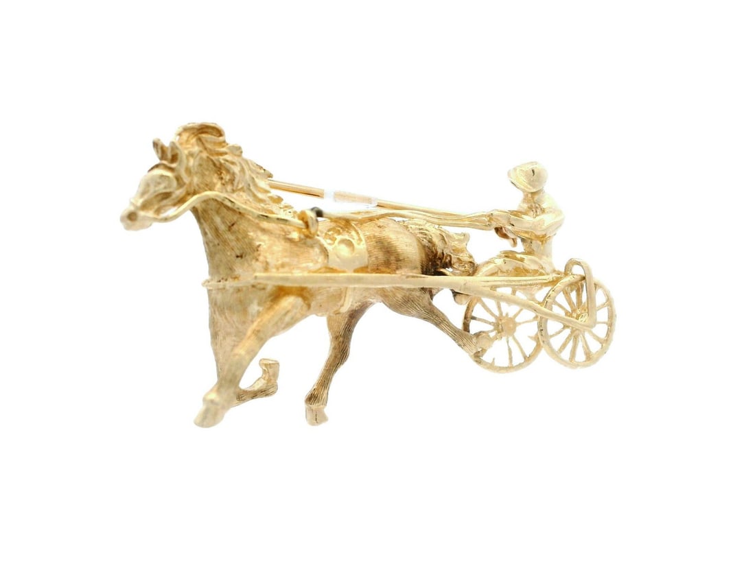 Vintage 13-14k Yellow Gold Jockey Horse Racing Brooch: Vintage 13-14k Yellow Gold Jockey Horse Racing Brooch This vintage collectible brooch showcases a beautifully detailed design of a jockey on a horse harness, crafted from solid 13-14k yellow gold. The