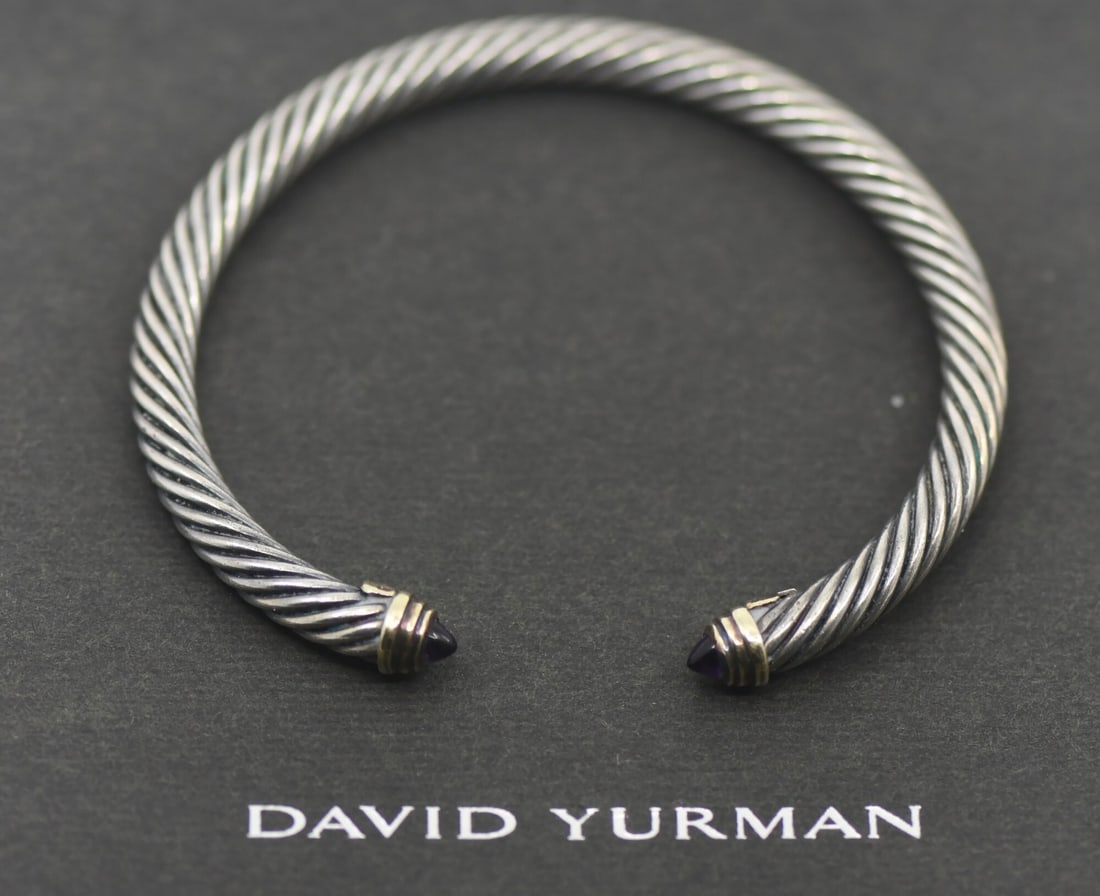 Sapphire Cuff Bracelet in Sterling Silver by David Yurman 7 Inch: Sapphire Cuff Bracelet in Sterling Silver by David Yurman 7 Inch This pre-owned David Yurman cuff bracelet features a 925 sterling silver construction accented with a sapphire as the main stone. The b