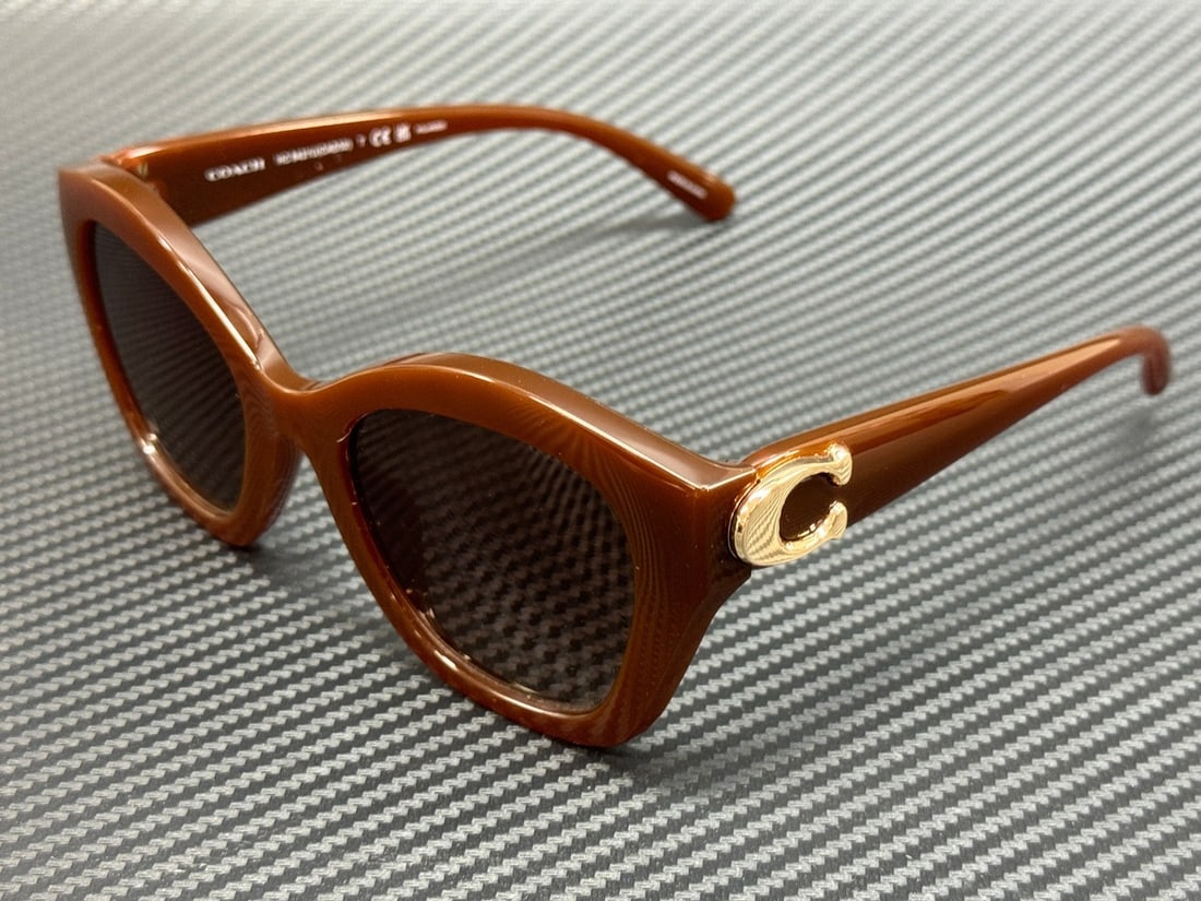 Coach HC8421U 5841T5 Hazelnut Brown Polarized 54mm Sunglasses with Authenticity: Coach HC8421U 5841T5 Hazelnut Brown Polarized 54mm Sunglasses with Authenticity These Coach HC8421U 5841T5 sunglasses are a stylish accessory featuring a hazelnut brown frame and brown polarized lense