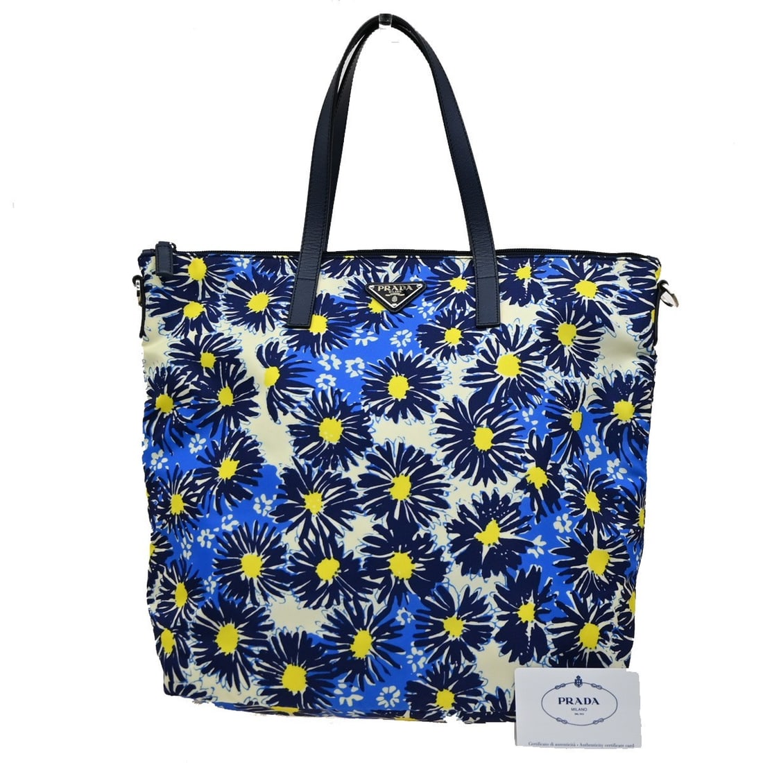 Blue Nylon Tote Bag Prada Convertible Zip 32cm by 35cm by 15cm: Blue Nylon Tote Bag Prada Convertible Zip 32cm by 35cm by 15cm This Prada Convertible Zip Tote for women features a durable blue nylon construction with a versatile design suitable for various occasio