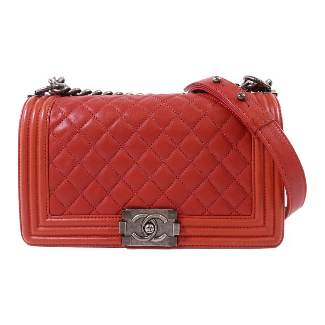 Red Calfskin CHANEL Boy 25 CC Chain Shoulder Bag: Red Calfskin CHANEL Boy 25 CC Chain Shoulder Bag This CHANEL CC Boy 25 chain shoulder bag is crafted from red calfskin leather and features the iconic CC logo. Designed as a regular-sized shoulder bag