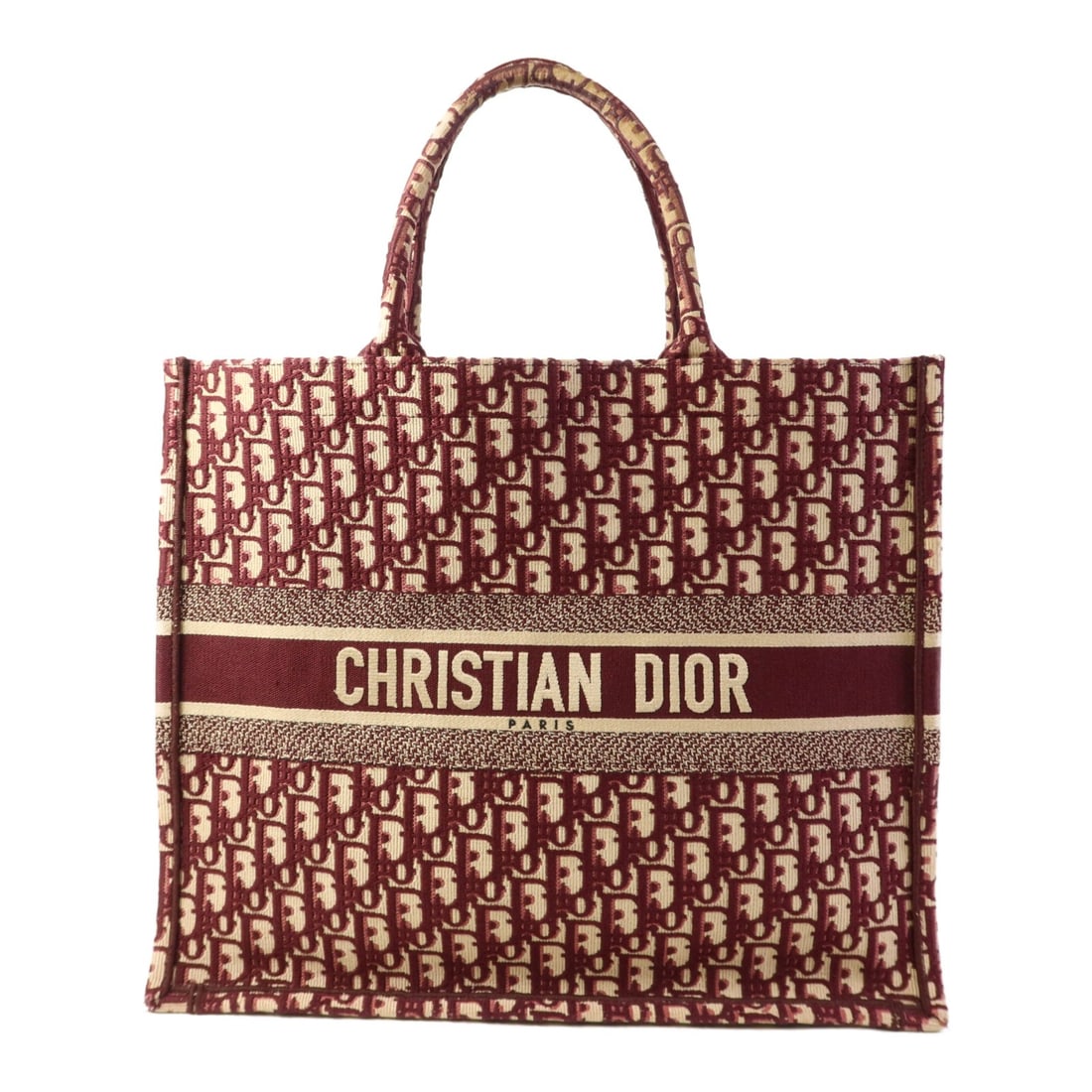 Christian Dior Red Canvas Tote Bag Made in France: Christian Dior Red Canvas Tote Bag Made in France This stylish Christian Dior CD Tote Bag is crafted from durable canvas in a vibrant red color. It features a spacious interior perfect for everyday es