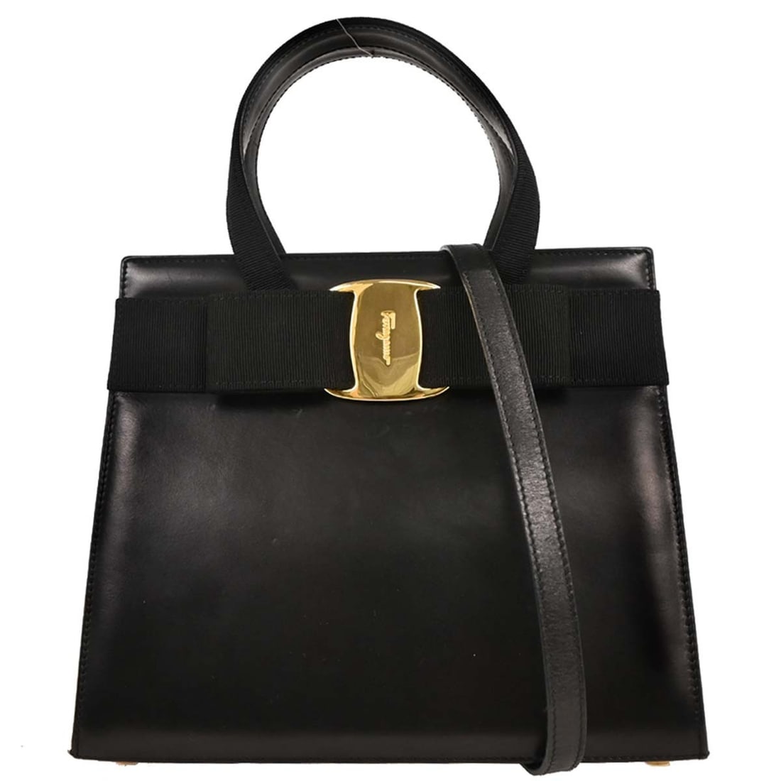 Leather Vara Bow Tote in Black by Salvatore Ferragamo: Leather Vara Bow Tote in Black by Salvatore Ferragamo This pre-owned Salvatore Ferragamo Convertible Vara Bow Tote is crafted from black leather and designed for women. The tote features a convertible