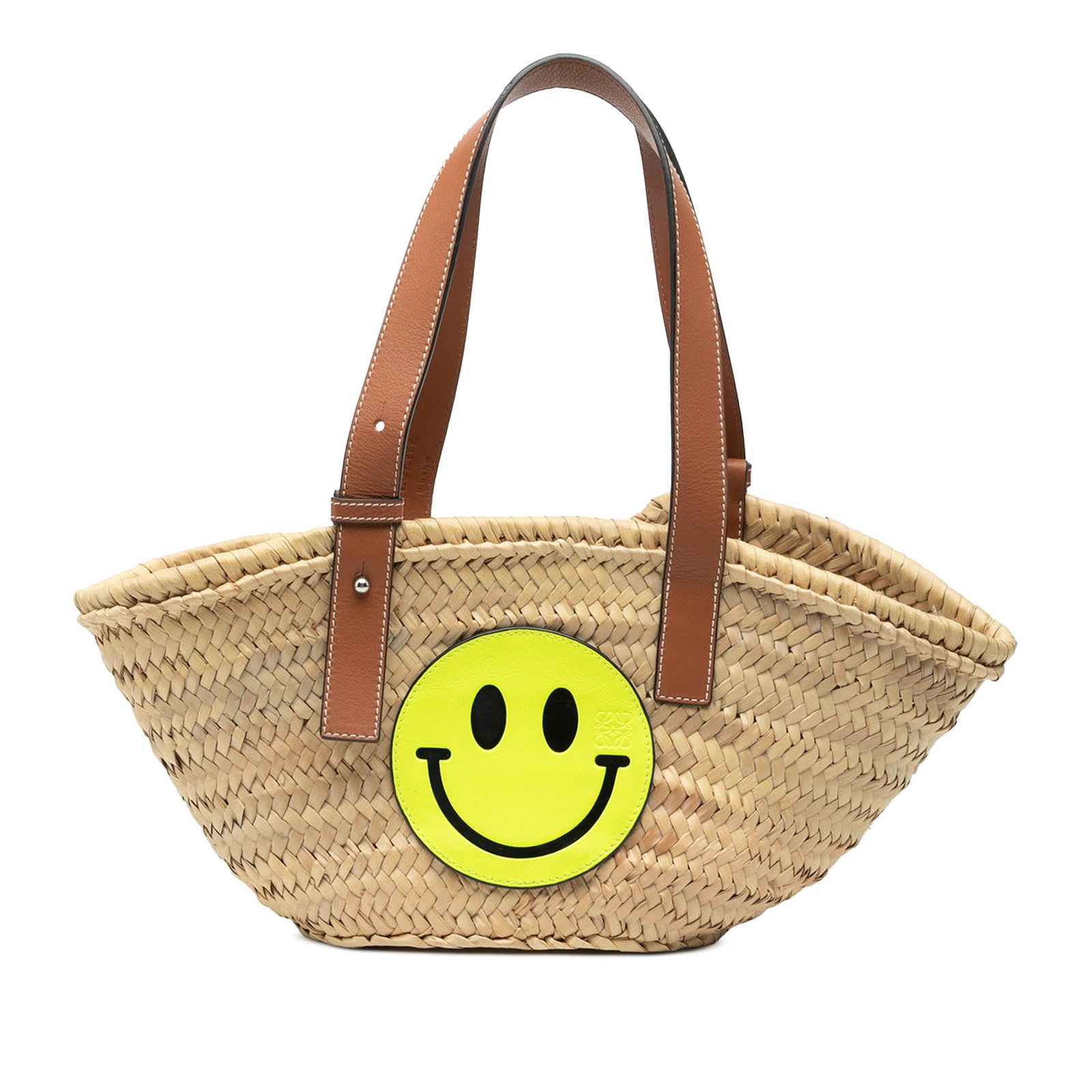 Paulas Ibiza Smiley Small Raffia Tote Bag by Loewe: Paulas Ibiza Smiley Small Raffia Tote Bag by Loewe This LOEWE Paula's Ibiza Smiley Small Raffia Basket Tote features a natural raffia body with an open top and adjustable flat leather handles. The bag