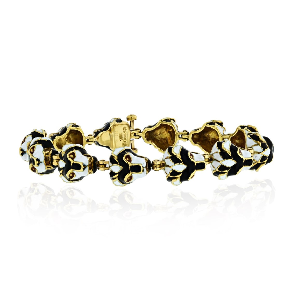 Vintage David Webb 18K Gold Tiger Head Enamel Link Bracelet with Certificate: Vintage David Webb 18K Gold Tiger Head Enamel Link Bracelet with Certificate This exquisite vintage David Webb bracelet showcases a striking design featuring black and white enamel tiger head motifs,