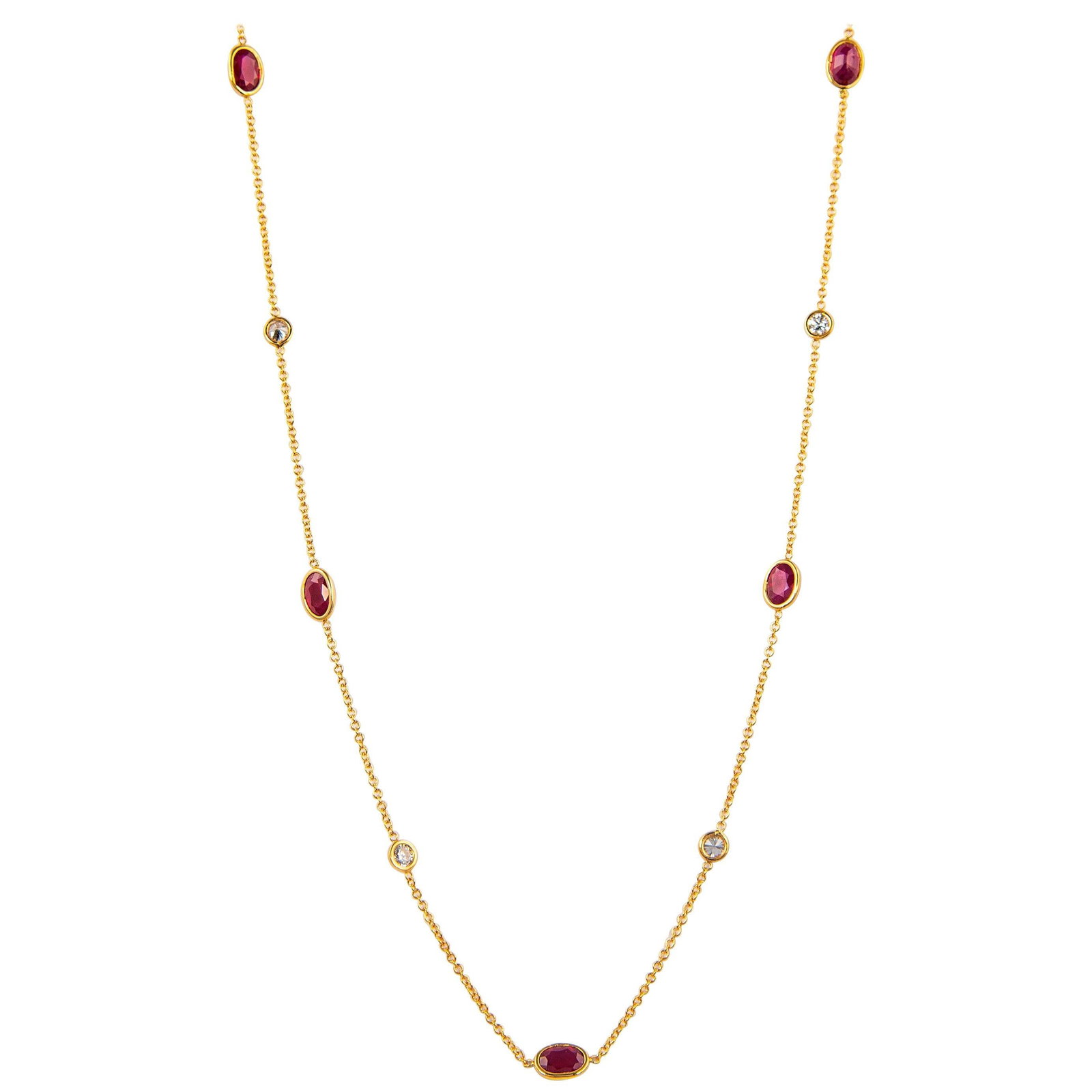 7.15ct Diamond Ruby Necklace 18k Yellow Gold 24in: 7.15ct Diamond Ruby Necklace 18k Yellow Gold 24in This stunning necklace features a total of 7.15 carats of exquisite round brilliant diamonds and oval cut rubies, elegantly arranged by the yard. Craf