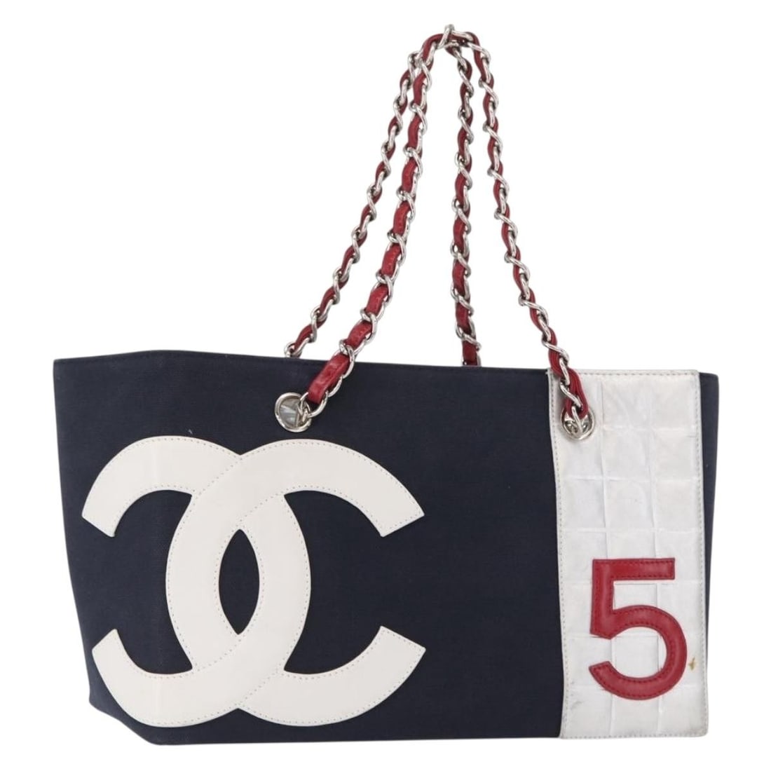 Chanel Navy Canvas Choco Bar Tote with Chain Handles and Silver CC: Chanel Navy Canvas Choco Bar Tote with Chain Handles and Silver CC This is a CHANEL Choco Bar Chain tote bag crafted from navy and silver canvas. The bag features chain handles and the signature CC lo