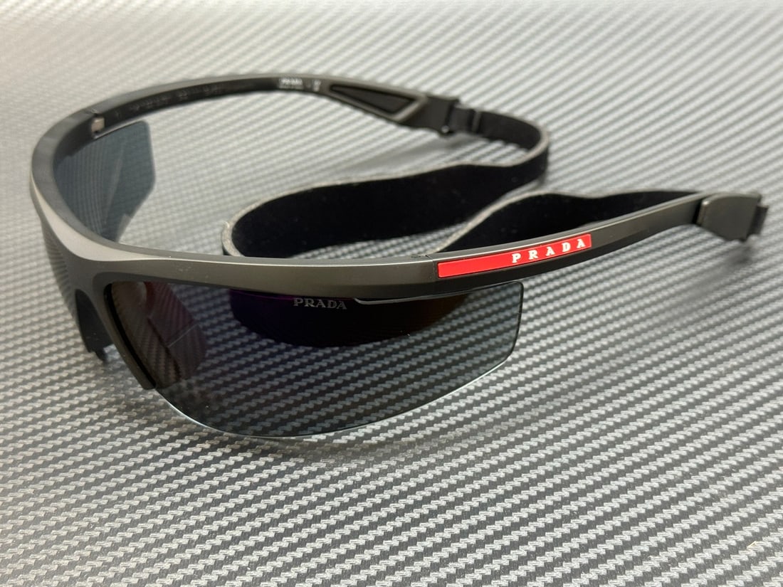 Prada Linea Rossa PS A02S 1BO10J Matte Black Sunglasses with Blue Mirror Violet Lenses: Prada Linea Rossa PS A02S 1BO10J Matte Black Sunglasses with Blue Mirror Violet Lenses Discover the Prada Linea Rossa PS A02S 1BO10J sunglasses, featuring a sleek matte black frame designed for a cont