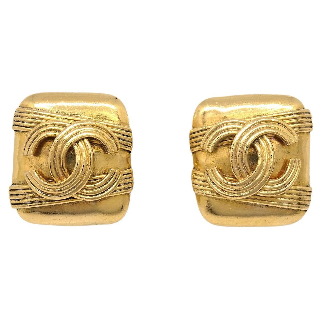 Gold Plated Chanel 94A Button Style Clip-On Earrings: Gold Plated Chanel 94A Button Style Clip-On Earrings These Chanel rectangle clip-on earrings feature a button style and are crafted from gold-plated material. Designed with a classic gold tone, they o