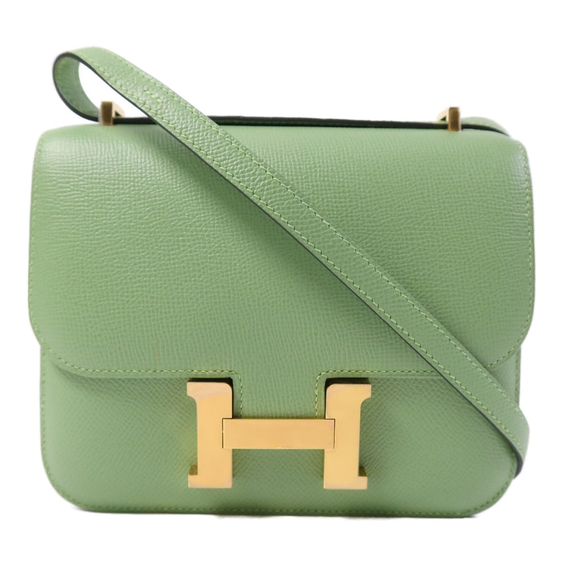 Hermes Constance Mini Green Epsom Leather Shoulder Bag with Gold Hardware: Hermes Constance Mini Green Epsom Leather Shoulder Bag with Gold Hardware This Hermes Constance Mini 2-way shoulder bag is crafted from Epsom calfskin leather in a Vert Criquet green color. Designed f